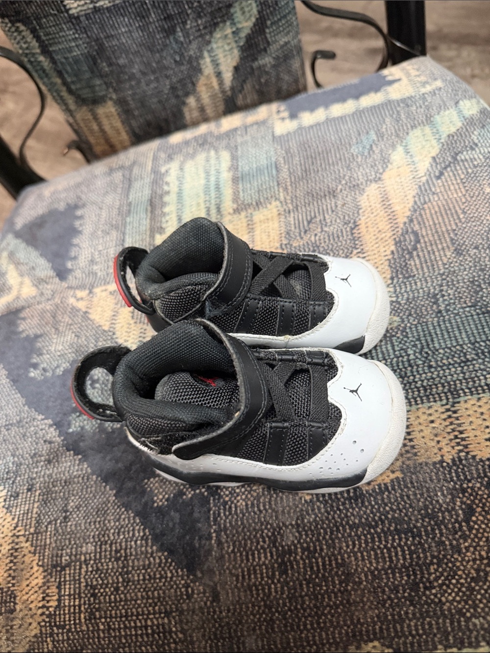 Jordan Kids Black and White High-Top Sneakers with Red Accent